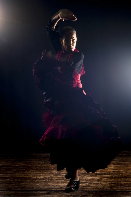 a female flame dancer performing a traditional dance