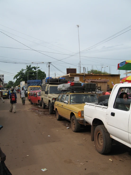 a group of cars in front of a building and another car on the other side