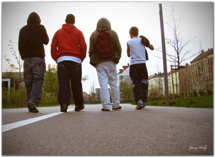 a group of people standing on a street