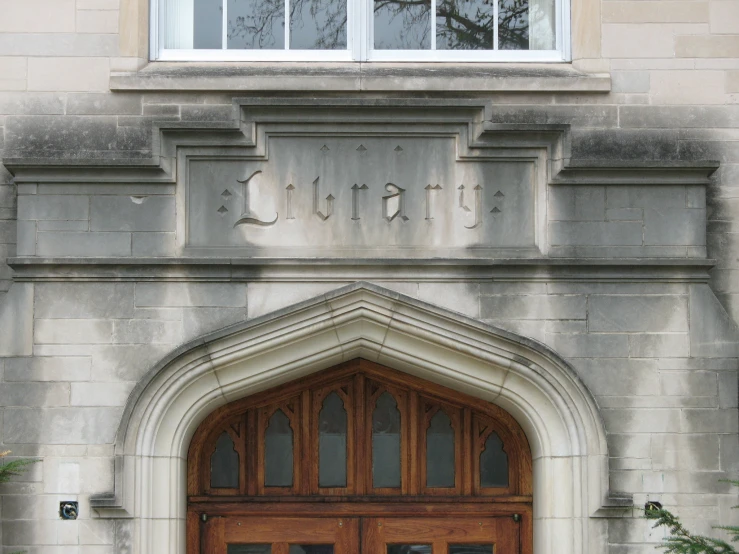 a door to an old building with a wooden gate