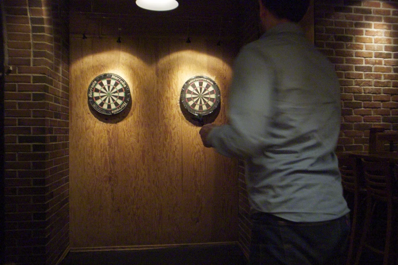 darts are on two darts that appear to be in the center of a dartboard