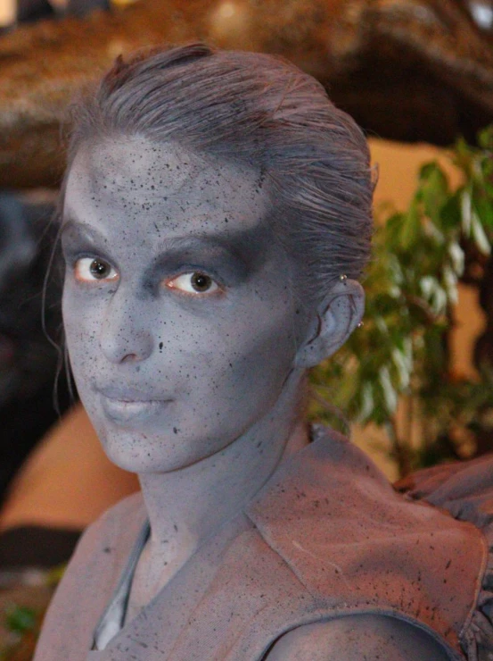 there is a woman with blue makeup on her face