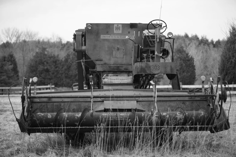 an old fashioned tractor in an empty lot