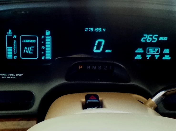 the dashboard of a vehicle with two clocks on each of it
