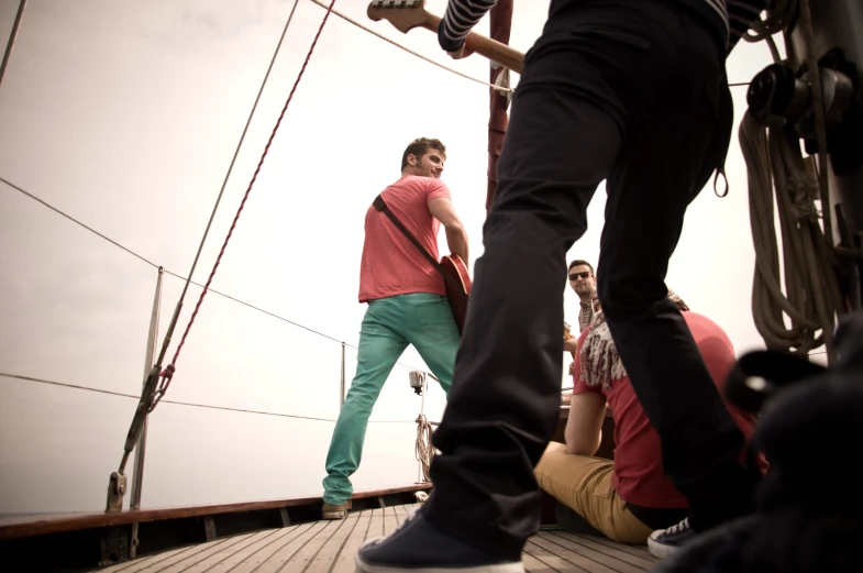 a group of people standing on top of a boat