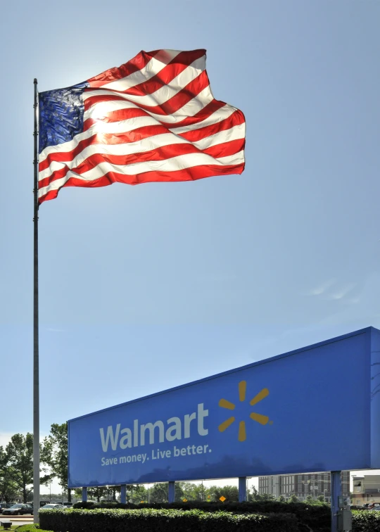 a walmart sign is waving in the wind