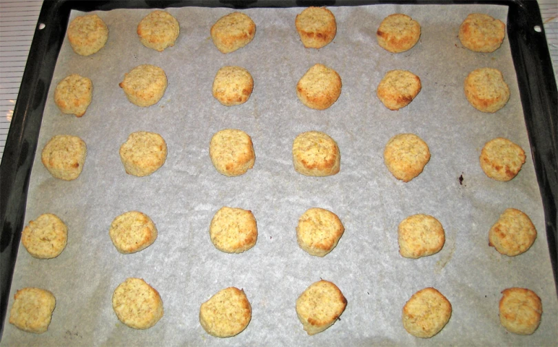 a tray with cookies sitting on it that has been baked