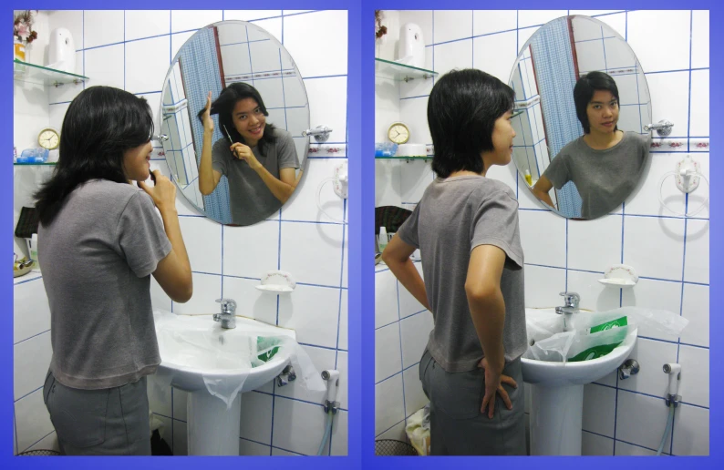 a girl brushing her hair standing in front of a mirror