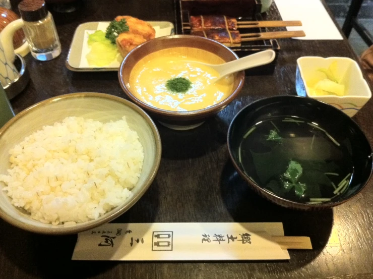 this is the food in various bowls on the table