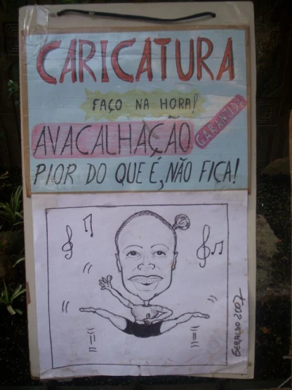 a sign in the language of caricatura is posted on a wall
