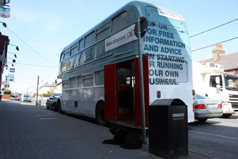 a double decker bus parked on the side of a street