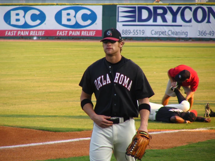 a baseball player is standing on the field