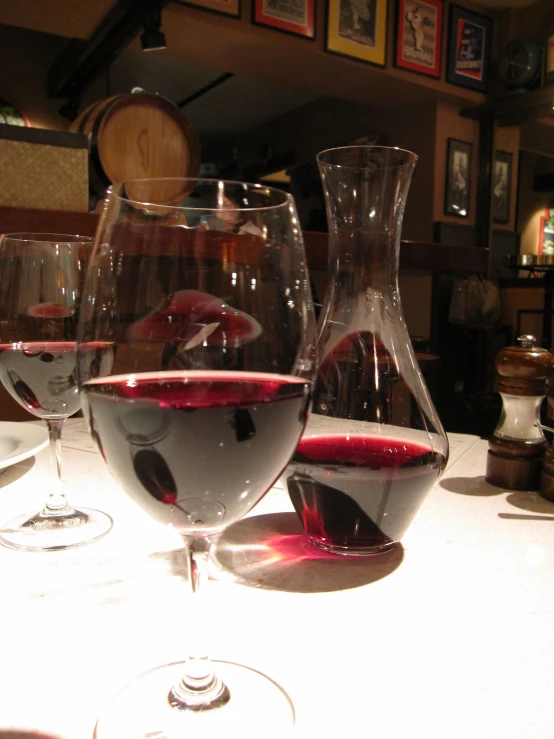 wine glasses on display in front of an advertit