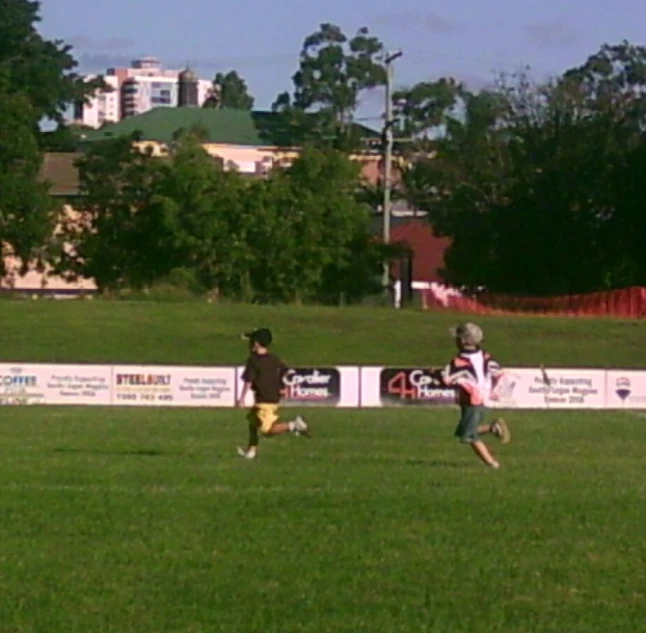 people are out in the field playing soccer