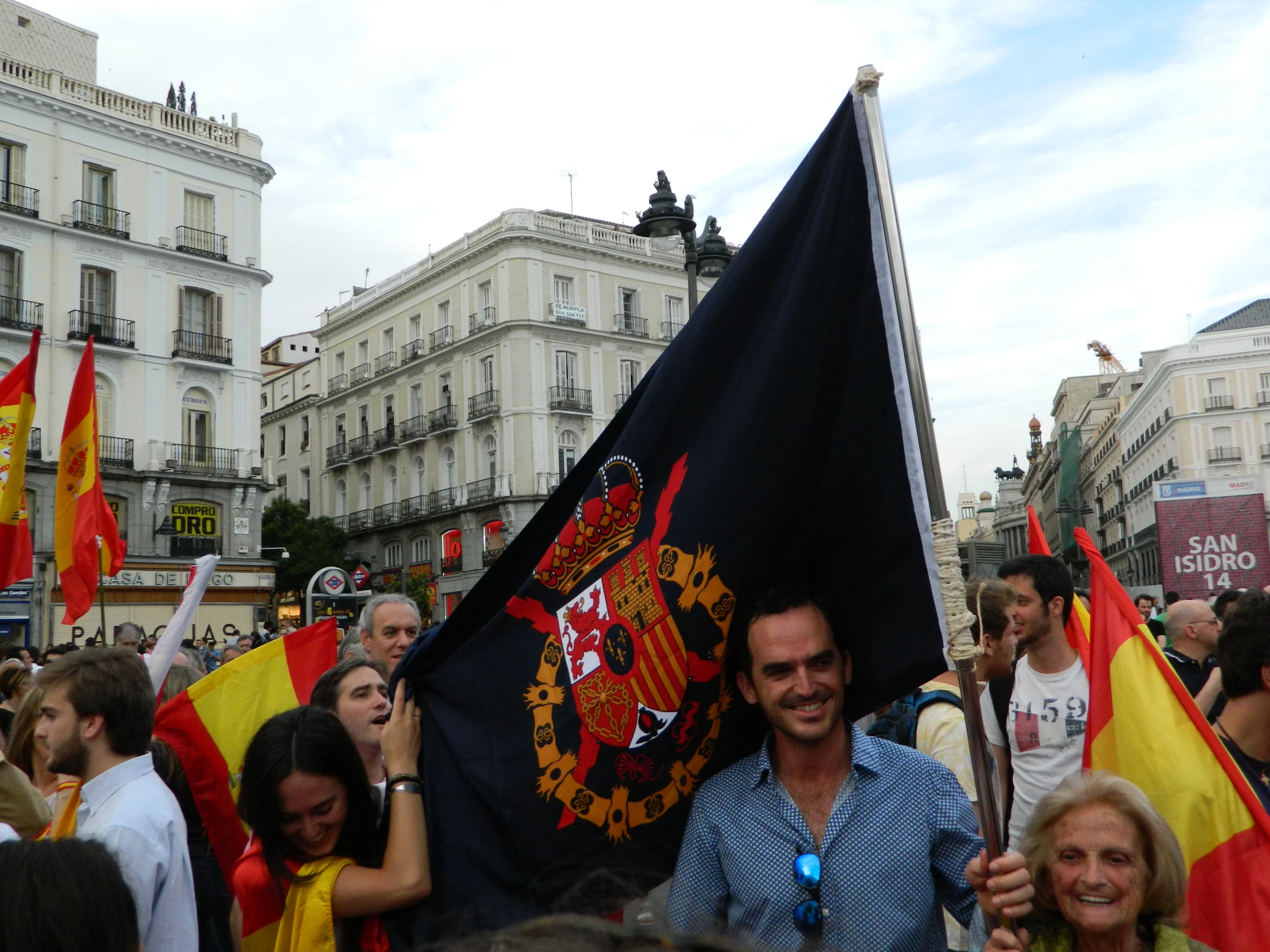 some people are holding flags and smiling