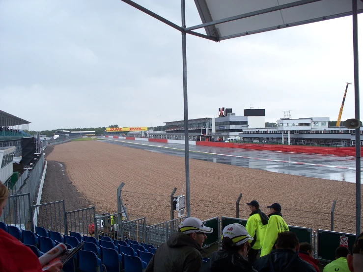 many people looking at a track from the stands