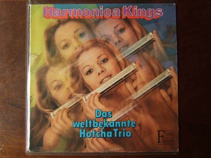 a cd with the cover art of harmonica kings