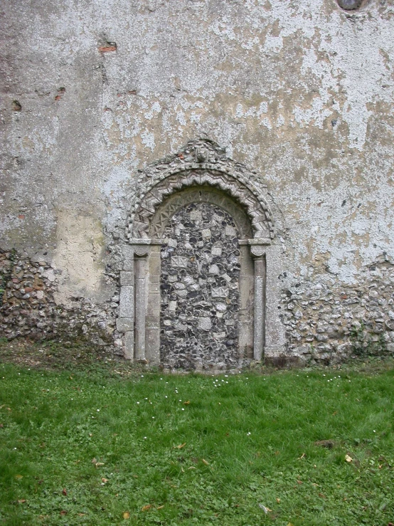 the small arch is made up of stone