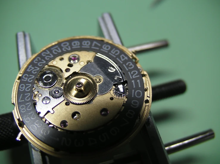 a close up po of an antique watch movement