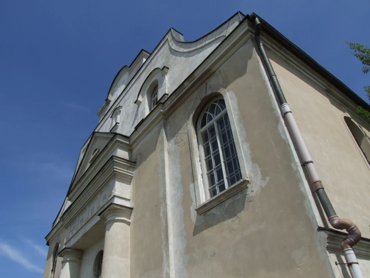 a church steeple with some windows on top