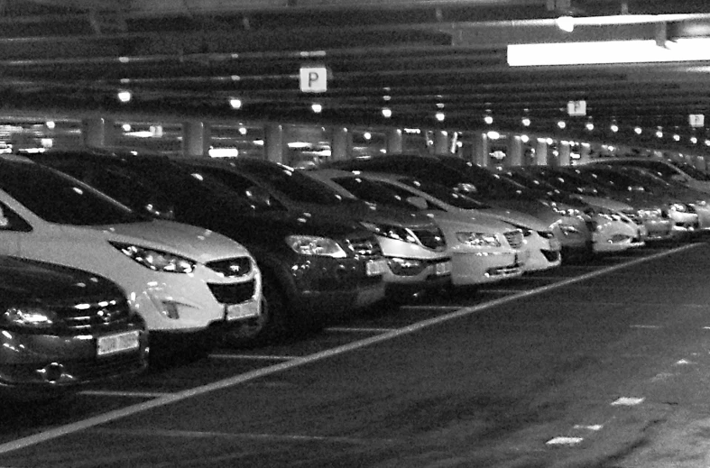 a group of cars parked in a parking garage