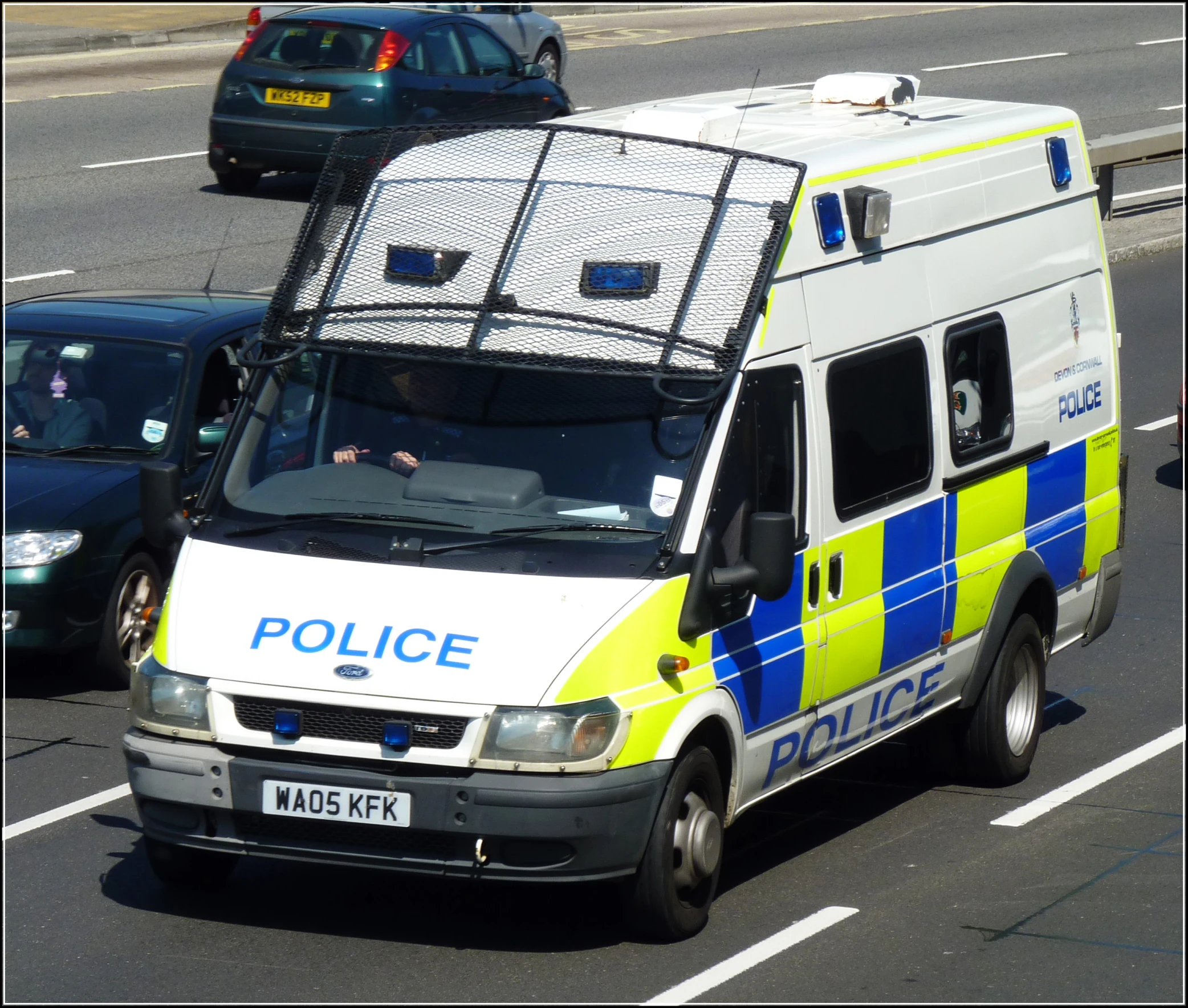 an image of an ambulance that is driving down the street