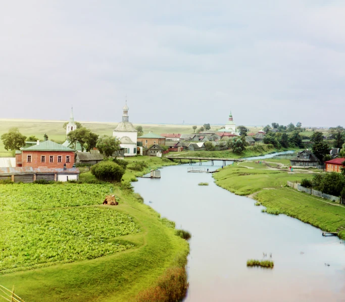 the river is moving in a beautiful country side