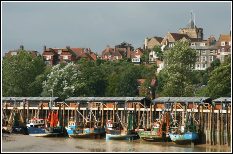 a group of boats parked next to each other at a dock