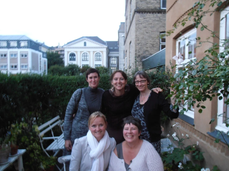 a group of women who are posing for a po