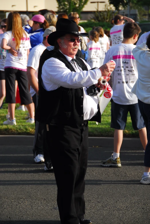 a man in a hat walks down the street