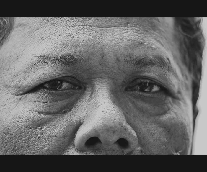 a close up view of a man's face and eyes