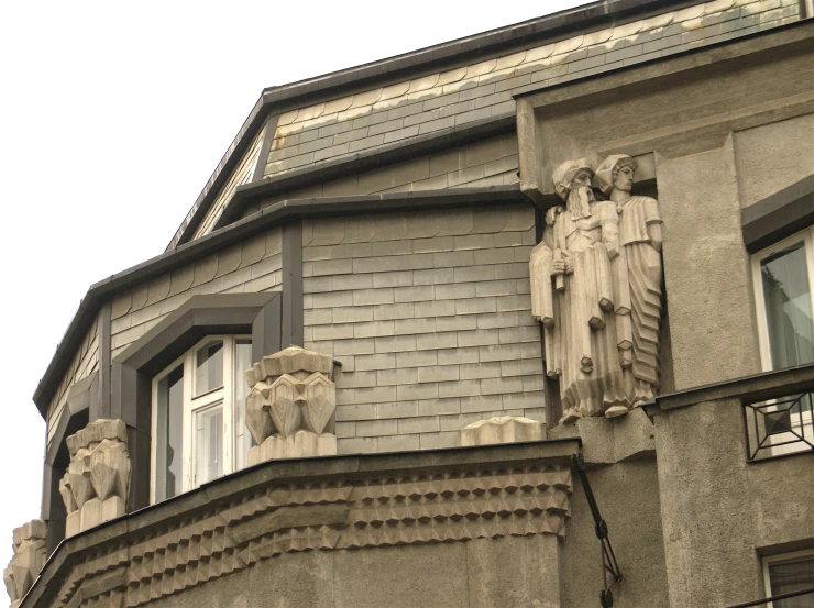 the architectural view of an old building, with statues