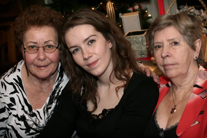 the three women are all dressed up for christmas