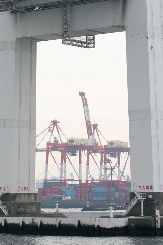 a large crane is on a long bridge