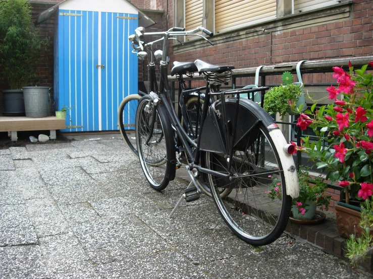 a bicycle that is parked on some concrete