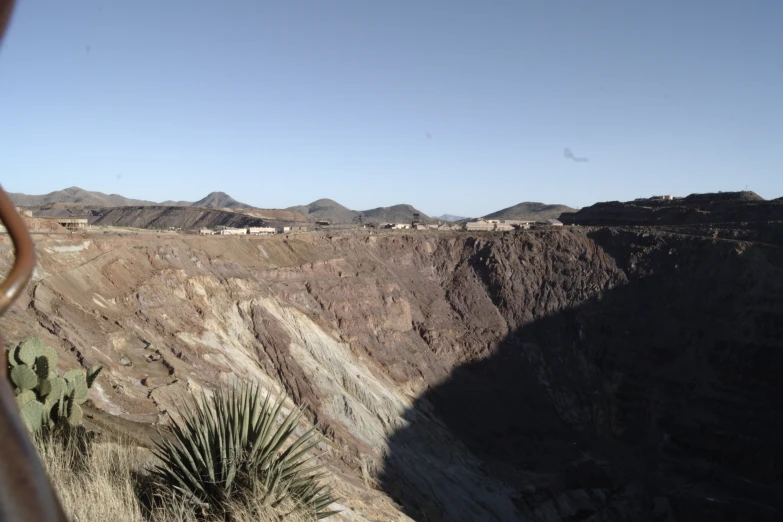 a mountain side with a big desert like landscape