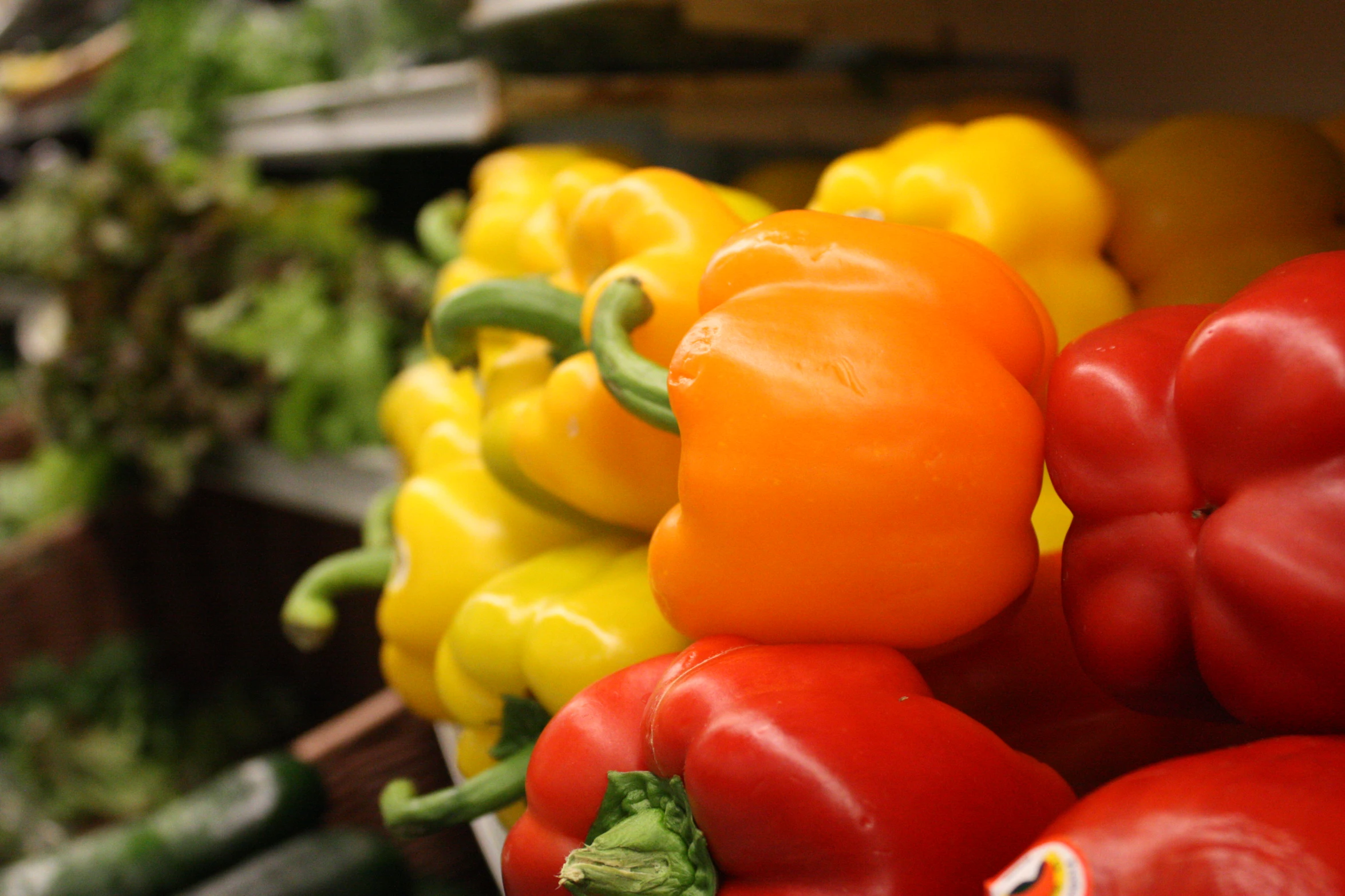 several different peppers are displayed in rows on display