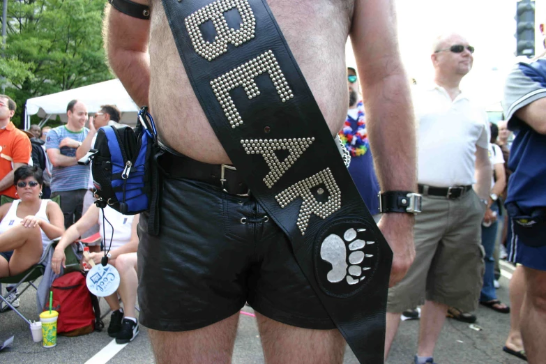 a man wearing shorts with his dog bone belt