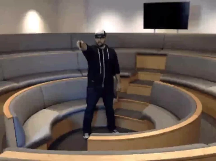 a person standing in an empty circular room