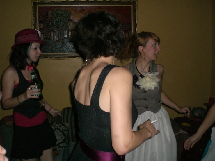 some women in dress attire standing near each other