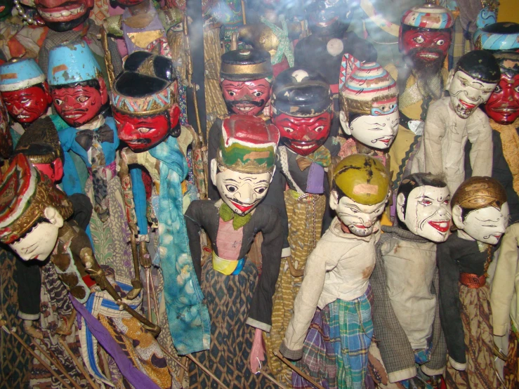 several masks and costumes on display together