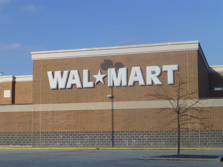 wall mart sign on the brick facade of a large shopping center