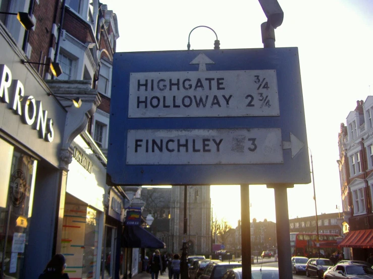two blue signs for the street where they are in