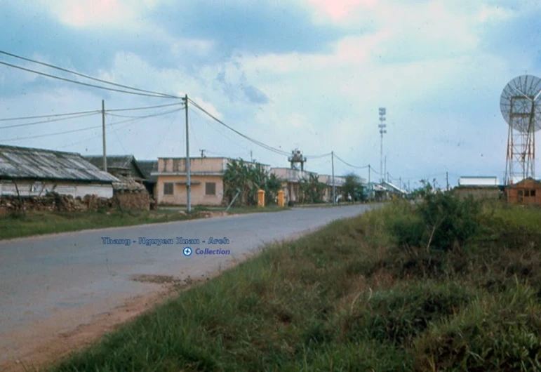 the side of a road with buildings on one side