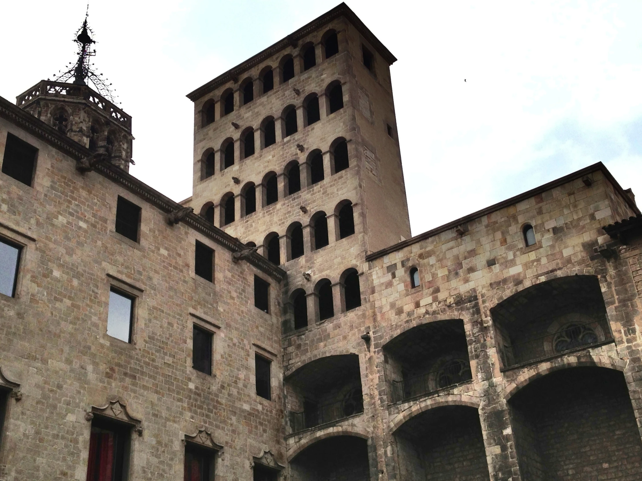 a very tall brick building with arched windows