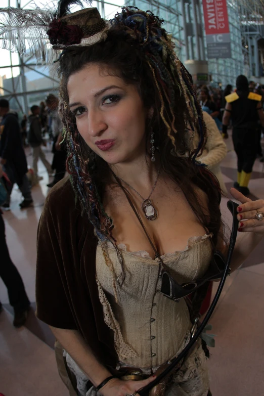 a young woman dressed as a pirate with dreadlocks on