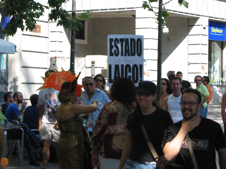 a group of people standing around in the street