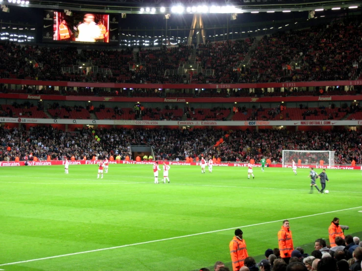 a soccer match in an empty stadium with fans