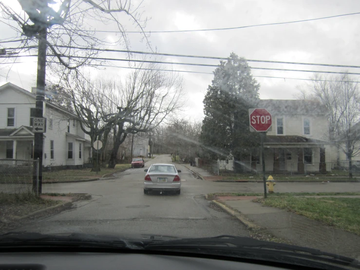 a stop sign in the middle of a neighborhood