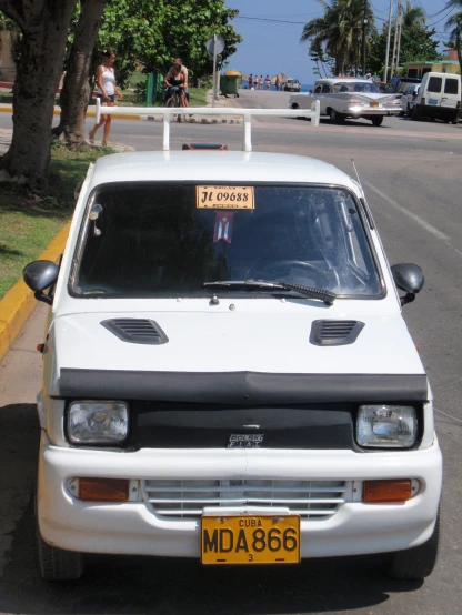 an image of a parked car with sign in the front